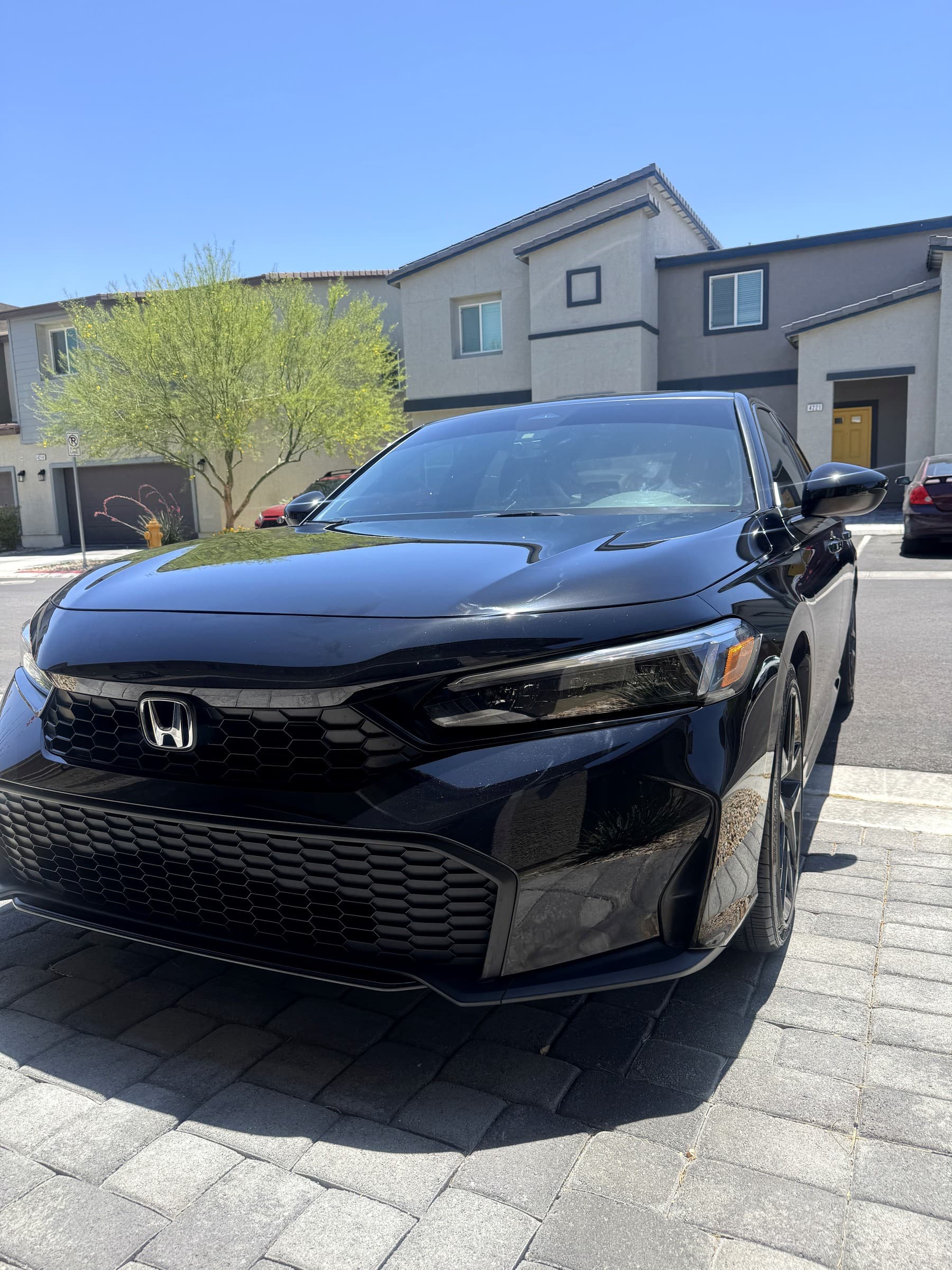 Glossy black Honda Civic with a freshly applied ceramic coating