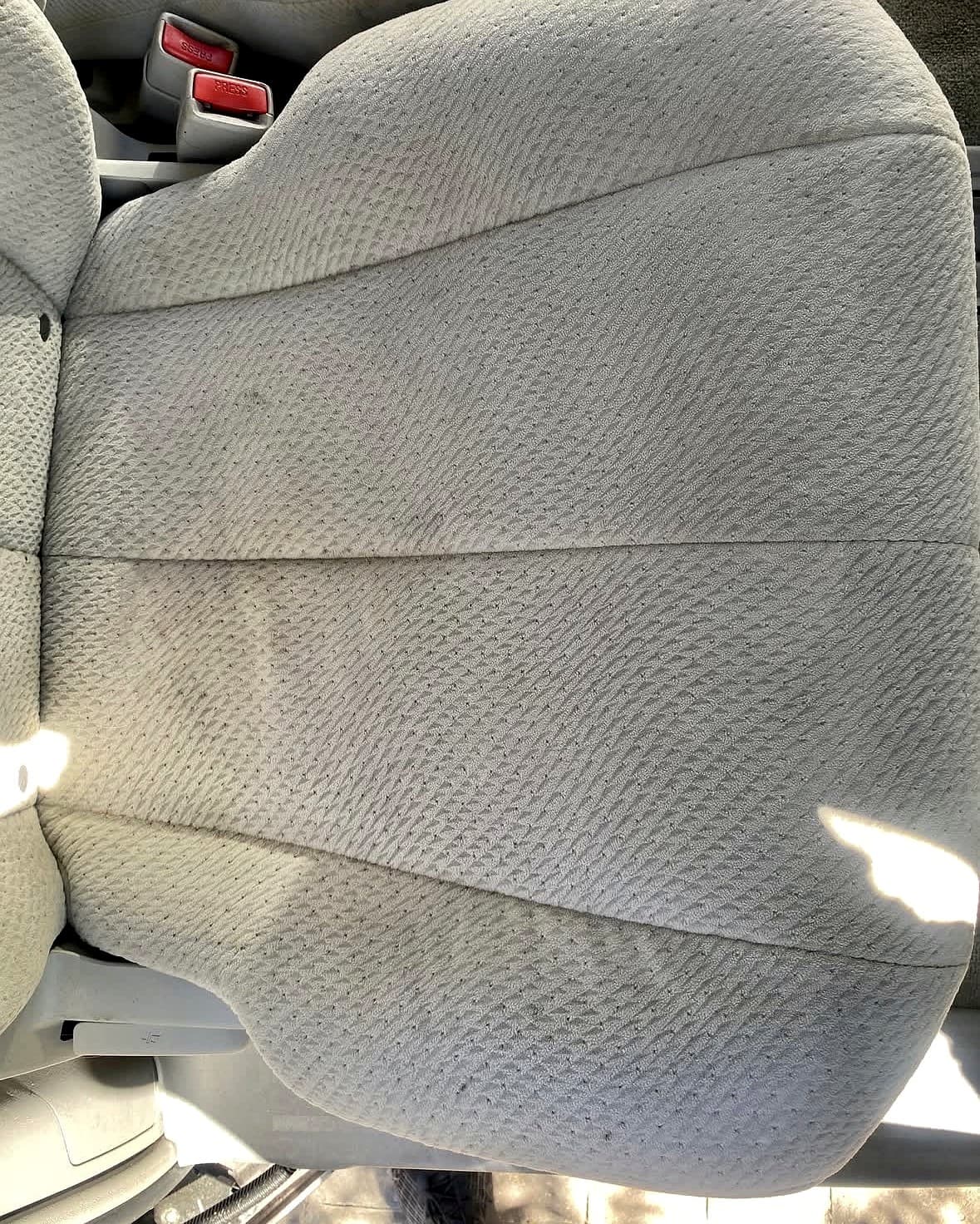 Cloth car seat after interior restoration, fully cleaned and stain-free
